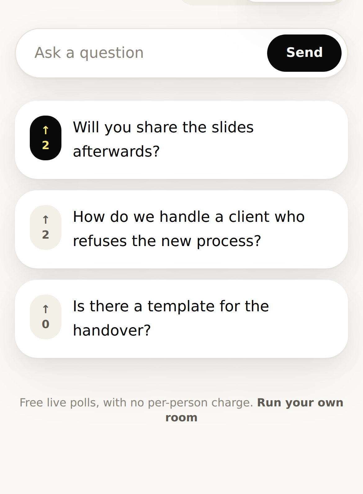 A phone on the Questions tab: three questions from the room, one upvoted